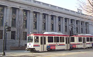 A TRAX train passing the Frank E. Moss Federal...