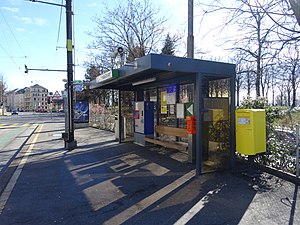 Shelter next to city street with inlaid track