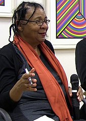 The oppositional gaze: The academic bell hooks developed male-gaze theory to account for the exclusion and invisibility of Black women from the male gaze and idealized white womanhood. Bell hooks, October 2014.jpg