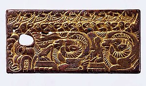 Belt Buckle with nomadic-inspired zoomorphic design, manufactured in China for the Xiongnu. Mercury-gilded bronze (a Chinese technique invented by the Daoists in the 4th century CE). North China, 3rd-2nd century BC. Belt Buckle with Zoomorphic Design, North China, 3rd-2nd century BCE.jpg