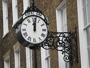 English: Clock on an office in John Street, WC...
