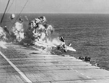 Ramp strike of a VF-124 F7U-3 on the USS Hancock on 14 July 1955 resulting in the deaths of the pilot, two boatswain's mates and a photographer's mate. LSO Ted Reilly manages to sprint across fantail and gets clear. Photo by PH2 James Binkley. F7U-3 CVA-19 ramp strike 1955.jpg