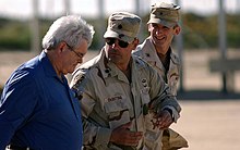 Gingrich tours the Ahmad al-Jaber Air Base in Kuwait, February 6, 2003 Newt Gingrich is greeted by Joseph DeAntona and Howard Bromberg.jpg