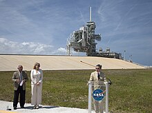KSC Director Bob Cabana announces the signing of the pad 39A lease agreement on April 14, 2014. SpaceX COO Gwynne Shotwell stands nearby. PAD 39A lease announcement.jpg