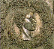 Bronze bas-relief of a young man's head
