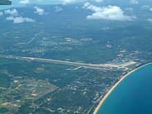 Aerial view of Phuket International Airport terminal building and runway