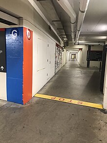Junction between tunnels near the Health Sciences Building. Note the alphabetic wayfinding signage distinguishing tunnel routes. Tunnels Carleton 2019.jpg