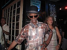 "Uncle" Lionel Batiste (in derby hat) with "Papa" Don Vappie (with banjo)