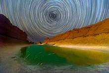 Star trail photography on salt lake in Lut desert in Iran