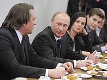 Konstantin Ernst, chief of Russia's main state-controlled TV station Channel One, Vladimir Putin, TV presenter Ekaterina Andreeva and TV host Dmitry Borisov. 2011-02-03 Vladimir Putin s kollektivom Pervogo kanala (16).jpeg