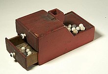 One of the earliest American ballot boxes using ballottas. This ballot box was used by members of the Association of the Oldest Inhabitants of the District of Columbia, a social club. Ballotboxballs.jpg