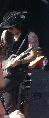 Fortus playing with the Dead Daisies in 2013 Dead Daisies (cropped)2.jpg