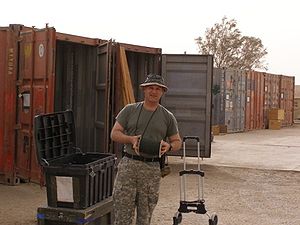 GI loads a shipping container. "On the 18...