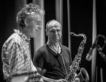 Bendik Hofseth is a protege of Mike Mainieri. Here both are at a concert on Cosmopolite Scene in Oslo in 2016. Mike Mainieri and Bendik Hofseth Cosmopolite (204014).jpg