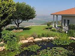 A house in Ramot Naftali with the Hula Valley in the background