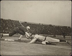 Pickoff attempt during one of the games. Frank Chance slides in safely past the tag of Jiggs Donahue. Pick-off attempt at first, 1906 World Series.jpg