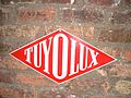 Plaque publicitaire Tuyolux Paris 1957.