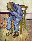 A picture of an old man sitting alone on a straw chair with his head in his hands, evoking intense sorrow.