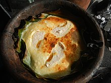 Bibingka, a traditional Filipino rice cake baked in a clay pot 7032Poblacion Baliuag Bulacan 28.jpg