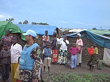 Internally displaced refugees in Bunia with MONUC personnel, 2004 Bunia displaced persons2.jpg