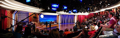 A panoramic view of the studio for Conan at Warner Bros. Studios in Burbank, featuring its audience area, band, and desk. Conan Set Panorama Stage 15.jpg