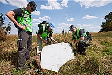 Dutch and Australian police at the crash site on 3 August 2014 Investigation of the crash site of MH-17.jpg