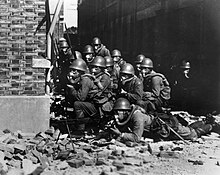 Japanese Special Naval Landing Forces with gas masks and rubber gloves during a chemical attack near Zhabei in the Battle of Shanghai Japanese Special Naval Landing Forces in Battle of Shanghai 1937.jpg