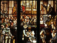 John Knox (top right) preaching the funeral sermon of the Regent Moray, depicted in a 19th-century window Knox Window.jpg