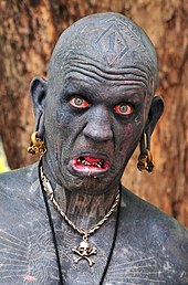 Lucky Diamond Rich is "the world's most tattooed person", and has tattoos covering his entire body. He holds the Guinness World Records title as of 2006
. Lucky Diamond Rich face.jpg