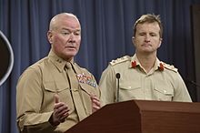 Marine Corps Maj. Gen. Walter Lee Miller Jr., former commanding general of Regional Command Southwest and 2nd Marine Expeditionary Force, and British Army Brigadier Paul A.E. Nanson, his former deputy commandin 140306-D-NI589-059.jpg