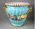 Coloured lead glazes majolica, flowers moulded in high relief. Shape first shown at the 1851 Exhibition by Minton & Co., Exhibit Number 60.