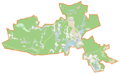 Mapa konturowa gminy Osiek, w centrum znajduje się owalna plamka nieco zaostrzona i wystająca na lewo w swoim dolnym rogu z opisem „Kałębie”