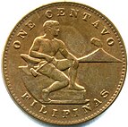 An American Philippines one centavo coin, featuring a shirtless man holding a hammer, seated on a rock with anvil, with a smoking volcano to his right. Above is the label "ONE CENTAVO", below is "FILIPINAS".