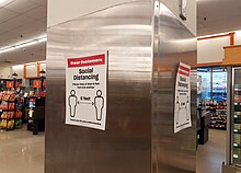 A social distancing sign in an Atlantic Superstore in Nova Scotia, Canada. Social distancing Signs at Atlantic Superstore (50001082706).jpg