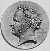 Profil gauche d'un homme sur une médaille grise.