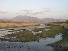 A view of the river looking upstream towards the central mountains