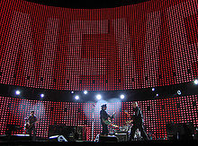 The outdoor stage of the Vertigo Tour, pictured in June 2005, featured a massive LED screen. U2 brussels fly 2005-10-06.jpg