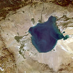 A satellite photograph of a lake in a dry landscape