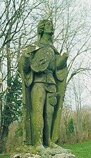 Estatua de trobador dins lo parc del chastèl.