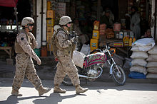 Two female Marines of the 2nd Marine Regiment patrolling in Afghanistan Defense.gov News Photo 100806-M-0301S-111 - U.S. Marine Cpl. Mary E. Walls right an ammunition technician and linguist Sahar both with a female engagement team patrol with 1st Battalion.jpg