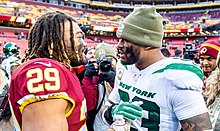 Adams alongside Derrius Guice in a game against the Washington Redskins Derrius Guice (cropped).jpg