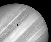 Затмение солнца спутником Ио на поверхности Юпитера