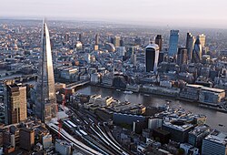 From top: The Shard and the City of London skyline, Buckingham Palace, and the Palace of Westminster