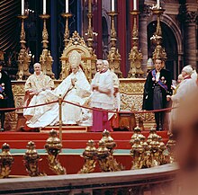 Pope Paul VI presiding over the introductory ingress of the Second Vatican Council, flanked by Camerlengo Benedetto Aloisi Masella and two Papal gentlemen Second Vatican Council by Lothar Wolleh 001.jpg