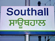 Sign in English and Punjabi at Southall railway station, Southall, Middlesex
