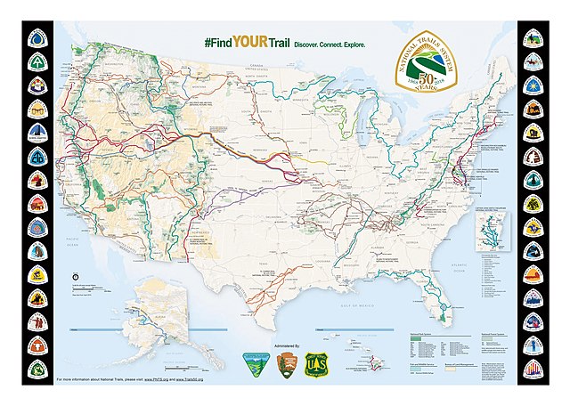 Map of the United States with trail routes marked and trail logos bordering it