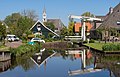 Watergang, view to the village with reformed church and drawing bridge