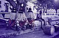 Three impatient dodos - men dressed as evil spirits - wait until they can perform. Jos Ceremony, Jos.