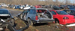 Junked cars stored at an auto scrapyard photog...