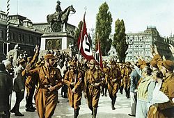 The Sturmabteilung of the Nazi Party, wearing their brown uniforms. Bundesarchiv Bild 147-0503, Nurnberg, Horst Wessel mit SA-Sturm.jpg